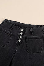 High-waisted button-fly wide-leg jeans by Trendsi, showcasing denim fabric, button closure, and relaxed fit with wide-leg style.