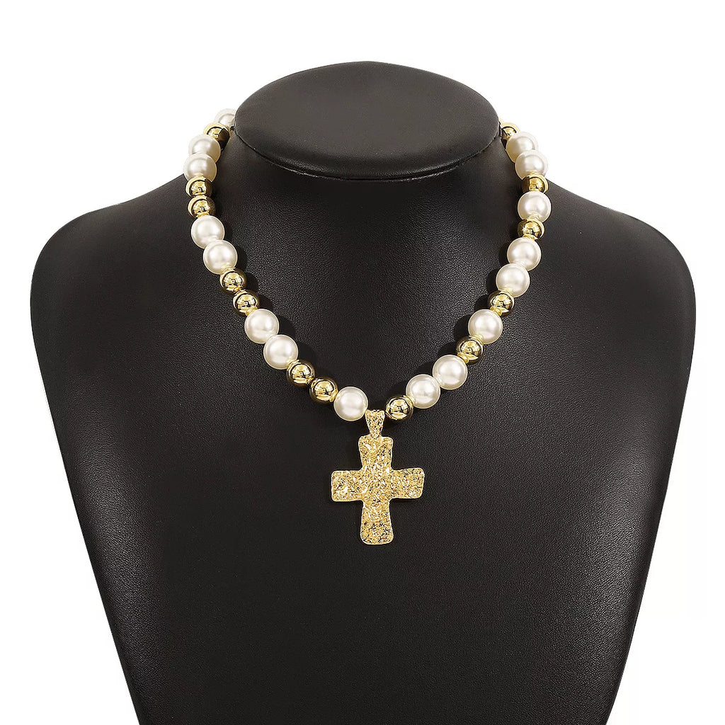 Pearl and cross pendant necklace by Shopimist, featuring a delicate pearl and silver cross charm on a fine chain.