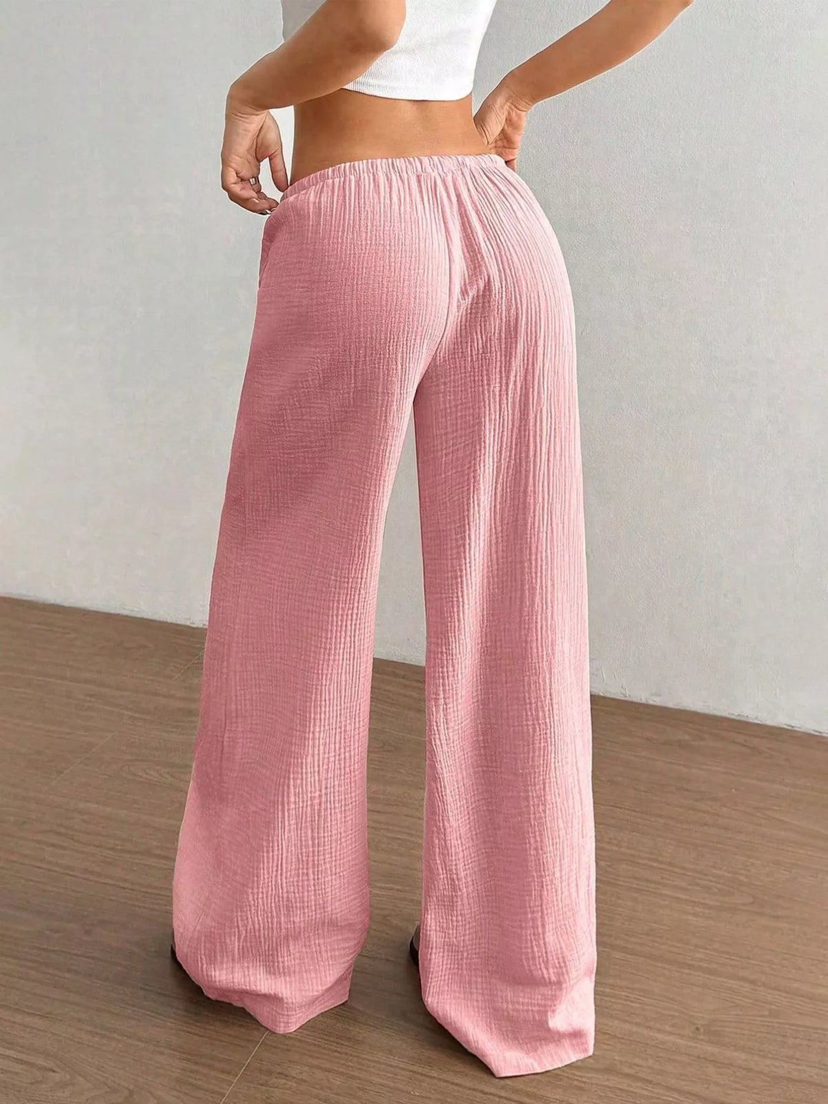 Plush Fashion Hub wide-leg drawstring pants made of plush fabric, featuring a relaxed fit and comfortable waistband.