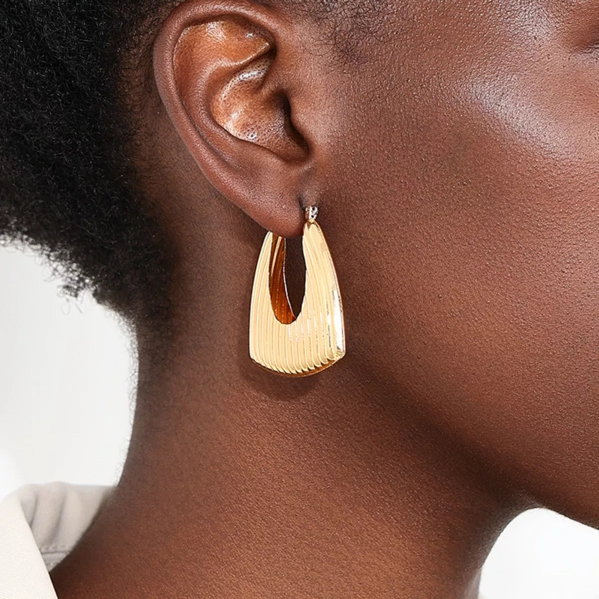 18K gold-plated alloy ribbed triangular hoop earrings, stylish jewelry with textured design, perfect for modern fashion accessories.