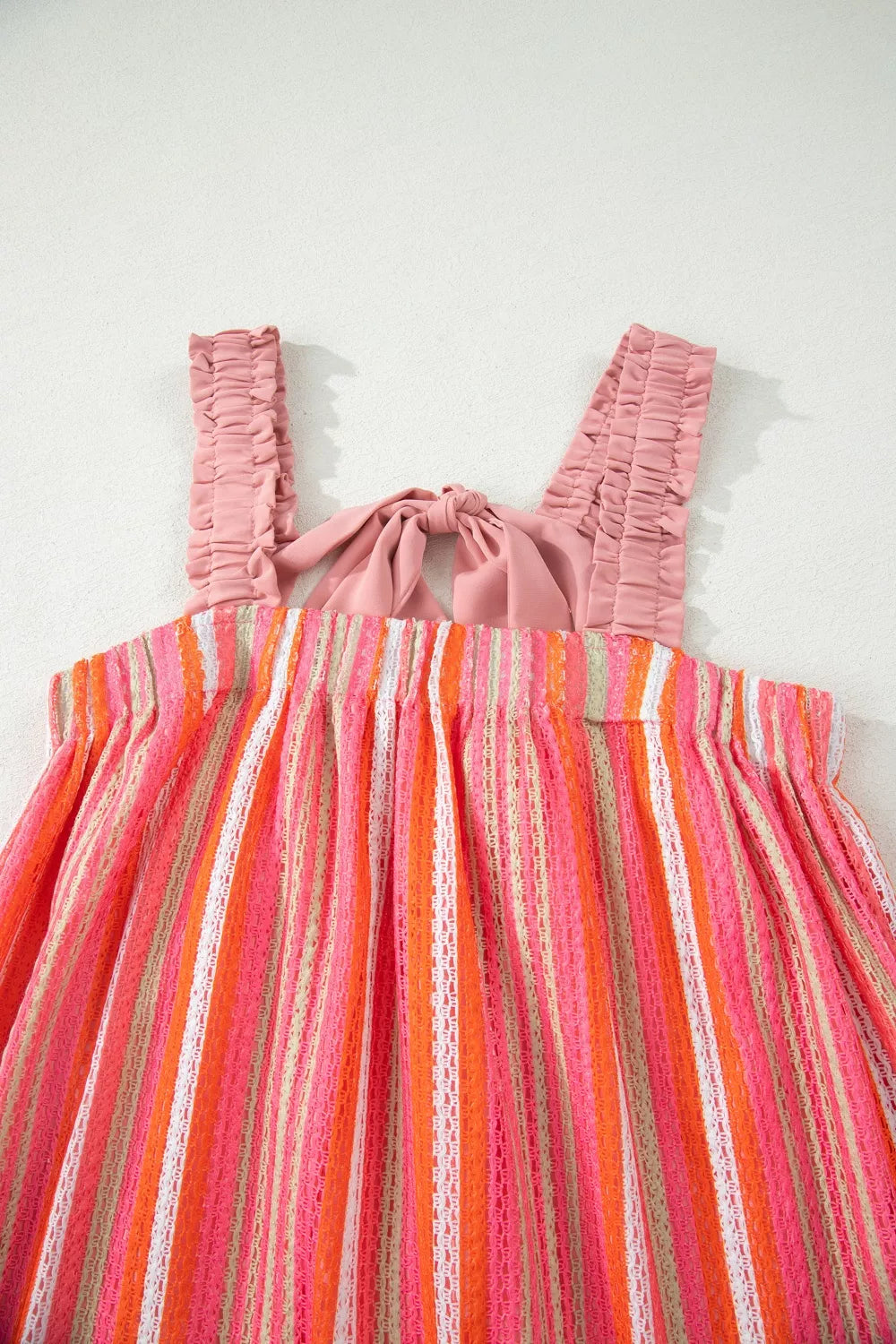Plush Fashion Hub Stripe ruffled straps ribbon knot flowy vacation maxi dress with a vibrant striped pattern and lightweight fabric.