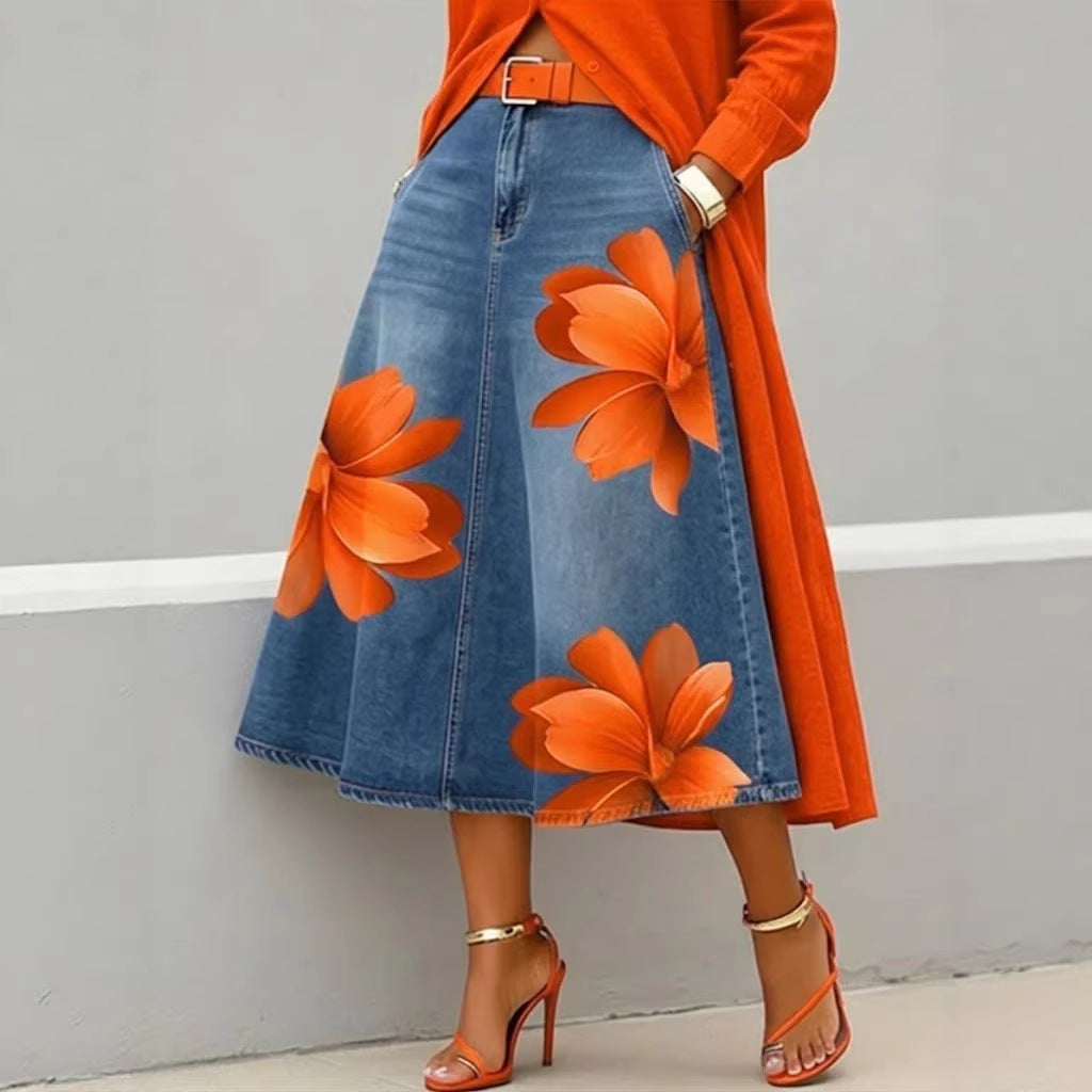 Women's floral print denim-style A-line midi skirt by FitiqueFit featuring boho-inspired design and flowy silhouette.