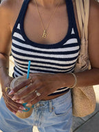 Striped halter neck cami top from Trendsi featuring bold vertical stripes and a stylish halter neckline.