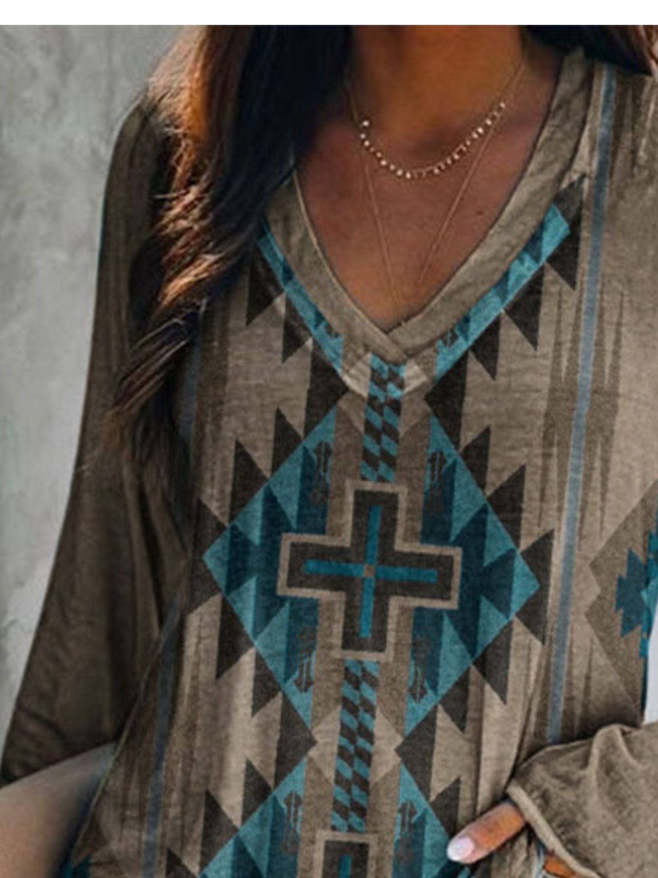 Plus size V-neck long sleeve T-shirt with geometric print from Trendsi, featuring a comfortable casual fit and stylish design.