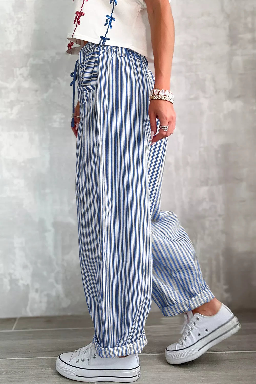Loose stripe drawstring casual pants by Trendsi featuring a relaxed fit and comfortable waistband, ideal for everyday wear.