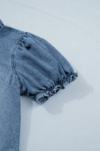 Ariana short sleeve snap blouse by Threaded Pear featuring a casual button-up design and lightweight fabric, shown in a close-up view.