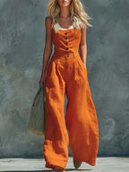 Women's retro button-front high-waist wide-leg jumpsuit by Plush Fashion Hub, casualwear style, shown on model with relaxed fit.