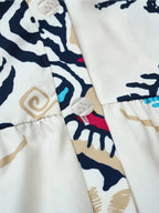 Bohemian print tiered mini dress by Shopimist featuring colorful layered fabric and a relaxed, stylish fit.