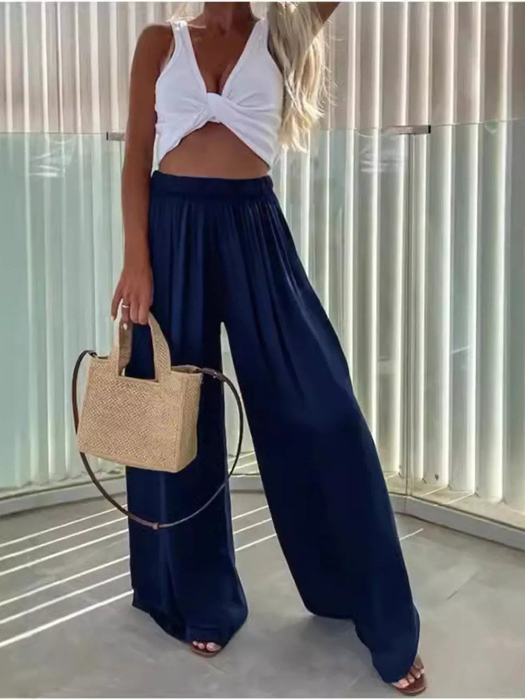 Flowy wide-leg pants from Trendsi featuring a relaxed fit, lightweight fabric, and a stylish drape, perfect for casual or chic looks.
