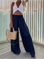 Flowy wide-leg pants from Trendsi featuring a relaxed fit, lightweight fabric, and a stylish drape, perfect for casual or chic looks.