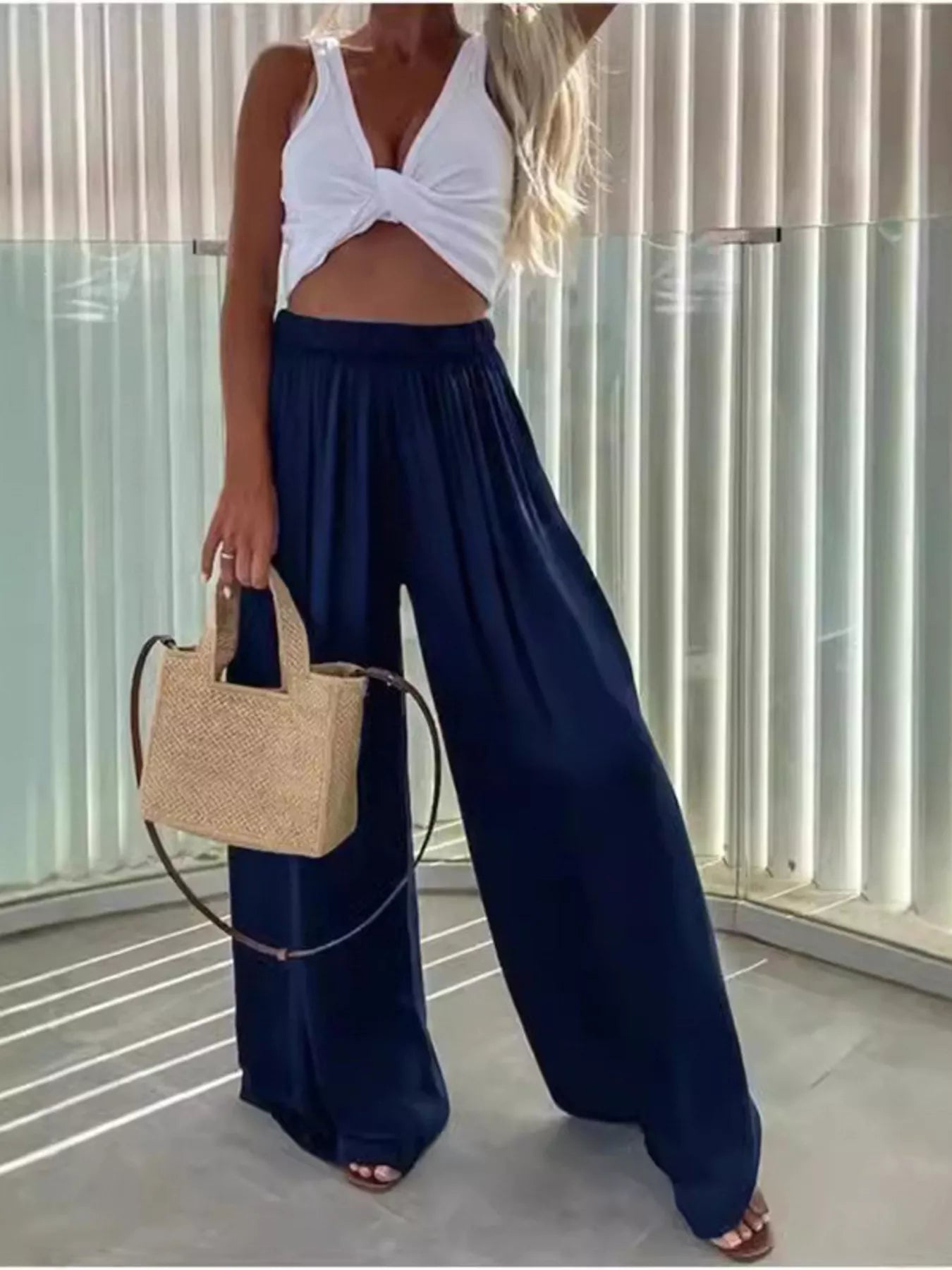 Flowy wide-leg pants from Trendsi featuring a relaxed fit, lightweight fabric, and a stylish drape, perfect for casual or chic looks.