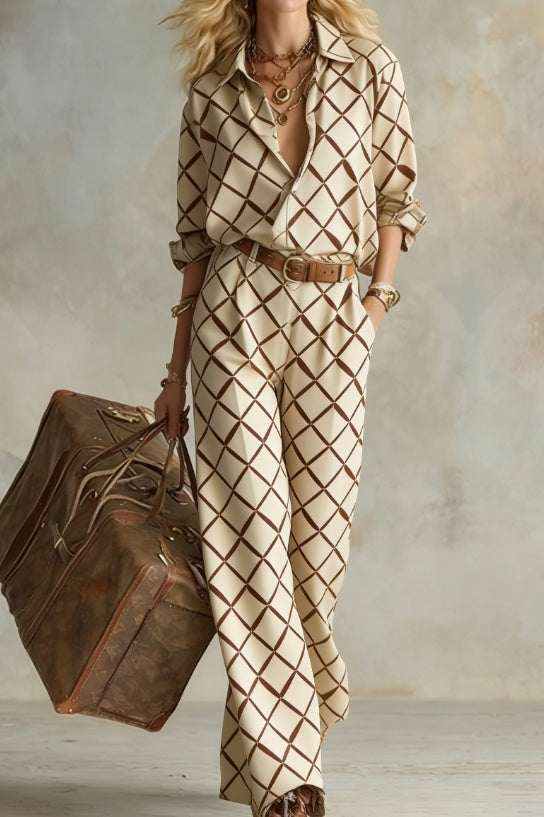 Women's vertical stripe collared long-sleeve shirt and wide-leg pants set by Plush Fashion Hub, casualwear with a relaxed fit.