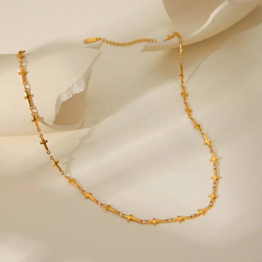 18K gold-plated cross necklace with delicate chain, stylish religious jewelry by Shopimist, displayed on a neutral background.