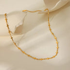 18K gold-plated cross necklace with delicate chain, stylish religious jewelry by Shopimist, displayed on a neutral background.