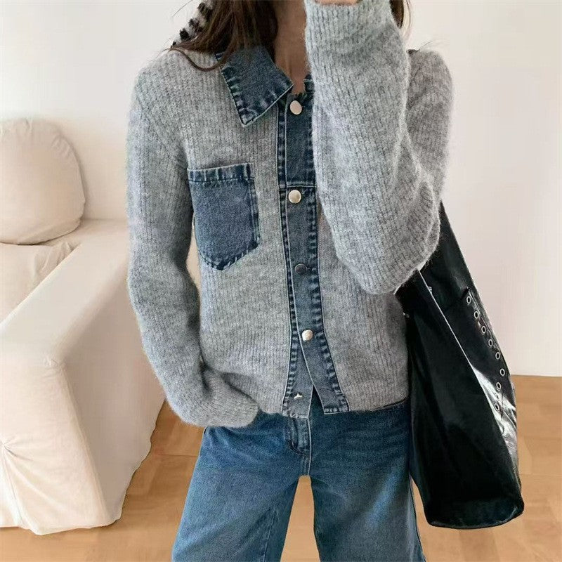 Grey knit cardigan with denim trim, lapel collar, chest pocket, and front buttons. Worn with jeans.