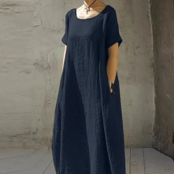 Solid navy blue maxi dress in a relaxed linen style, featuring a scoop neckline and short sleeves.