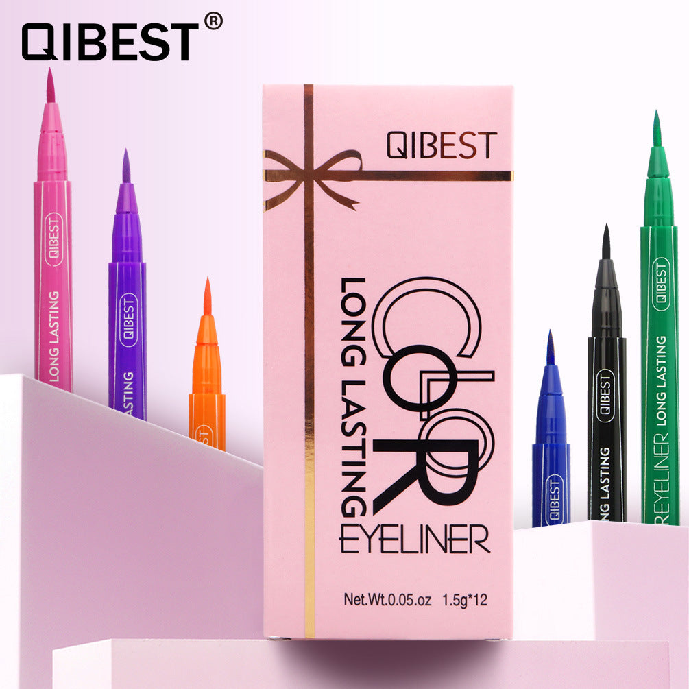 Pink cardboard box with a ribbon graphic and various colored Qibest long-lasting eyeliner pens.