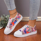 Women’s low top floral canvas shoes by Trendy Attic Store01, showcasing breathable design and colorful flower patterns.