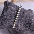 Vintage style beaded bar necklace by Shopimist featuring a delicate beaded chain and sleek bar pendant.