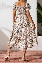 Women's square neck ruffle sleeve smocked midi dress made of cotton blend by Plush Fashion Hub, shown in a stylish, flowy design.
