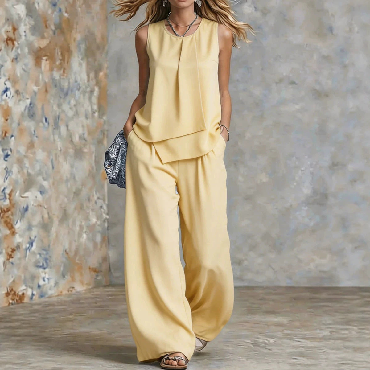 Women's sleeveless two-piece set by FitiqueFit featuring solid color wide-leg pants and matching sleeveless top.