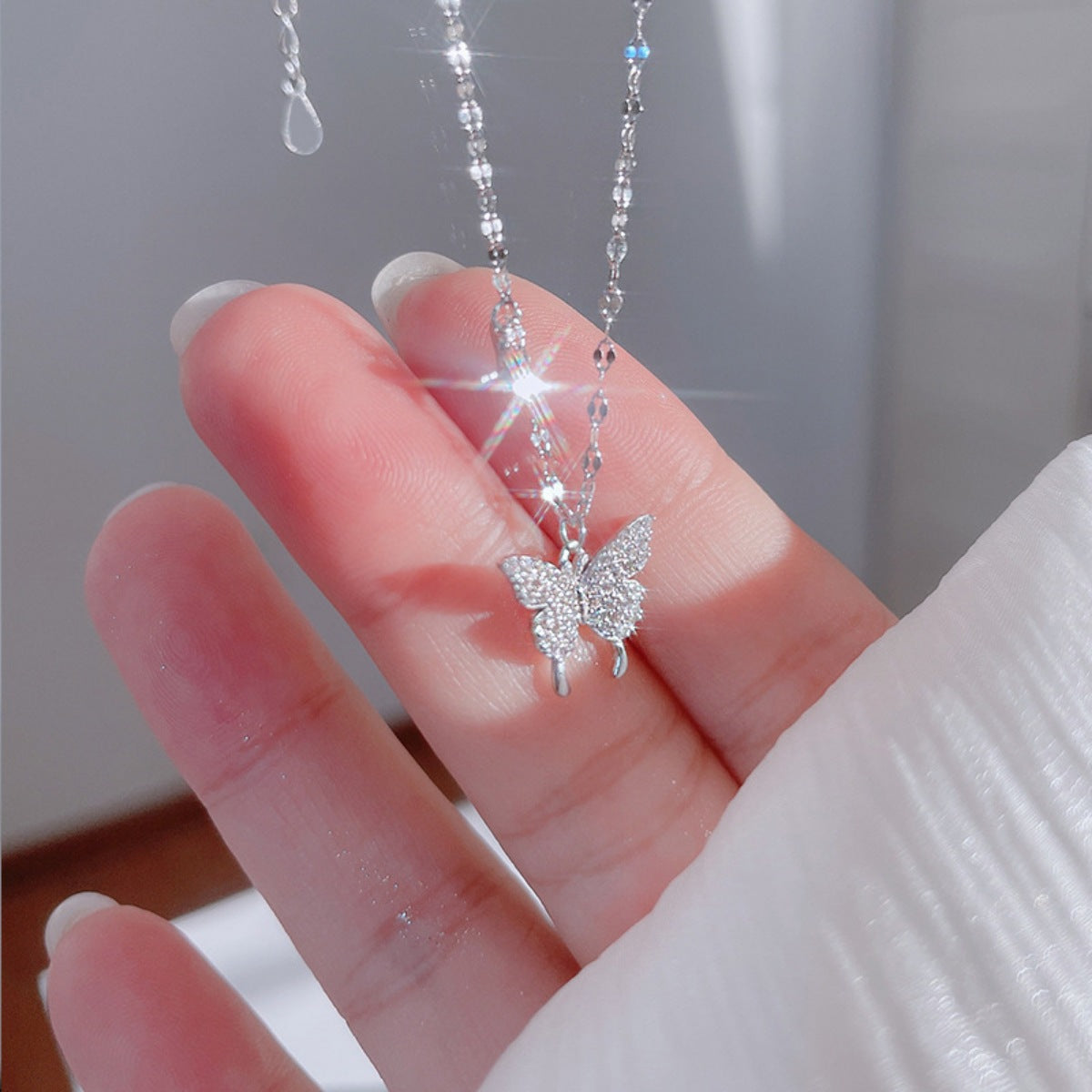 925 sterling silver butterfly necklace with sparkling zircon stones, featuring a delicate chain and detailed butterfly pendant.