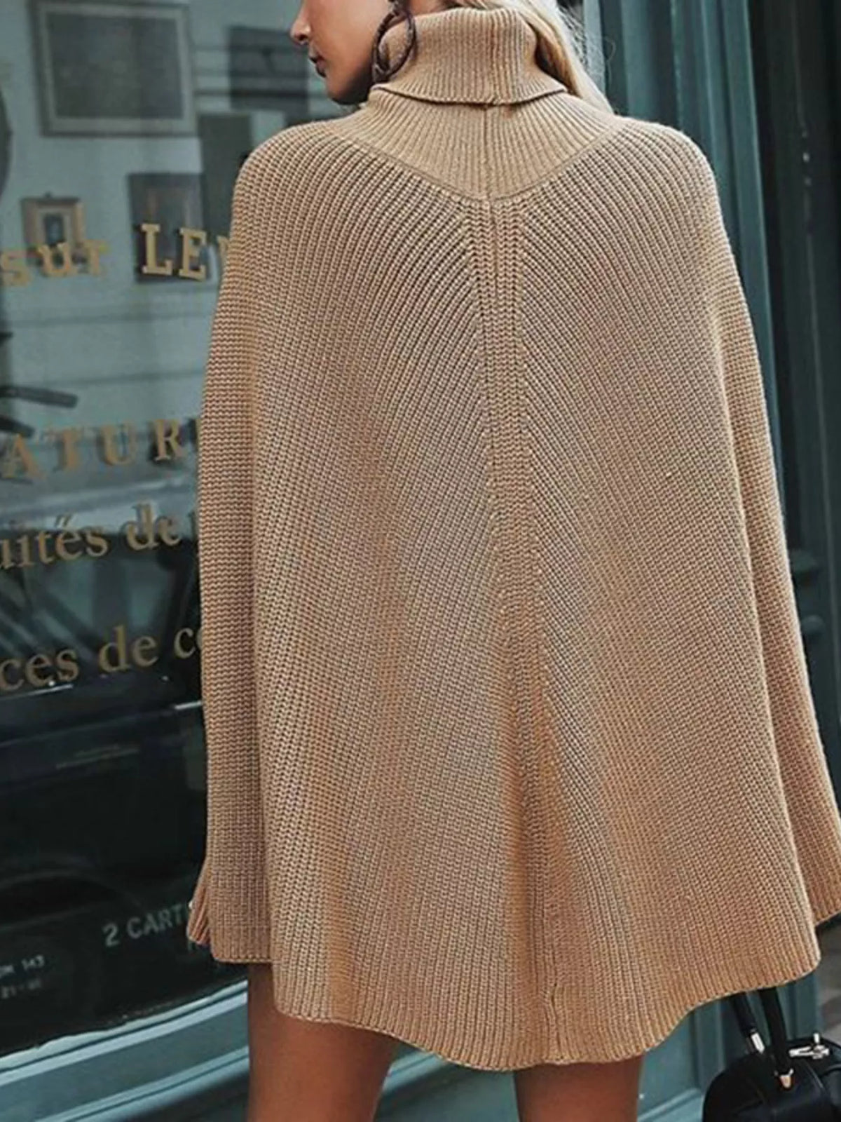 Oversized turtleneck poncho sweater by Trendsi featuring a cozy, draped design in soft knit fabric.
