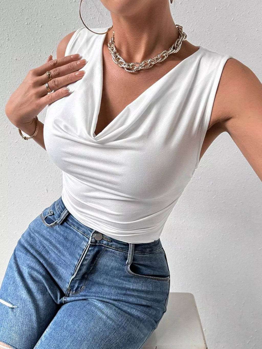 Cowl neck tank top from Trendsi featuring a relaxed fit, sleeveless design, and soft fabric in a neutral color.