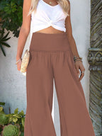Women's wide-leg smocked waist casual pants by Trendsi, lightweight and comfortable with relaxed fit and stylish design.