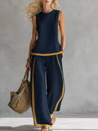 Plus size contrast stripe sleeveless top and wide-leg pants set by Plush Fashion Hub, stylish and comfortable casual outfit.
