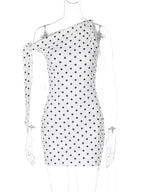 Polka dot sleeveless mini dress with bow accents by Shopimist, featuring a fitted bodice and playful design.