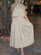 Women's striped sleeveless top and midi skirt two-piece set by Trendsi, featuring a stylish matching striped design.