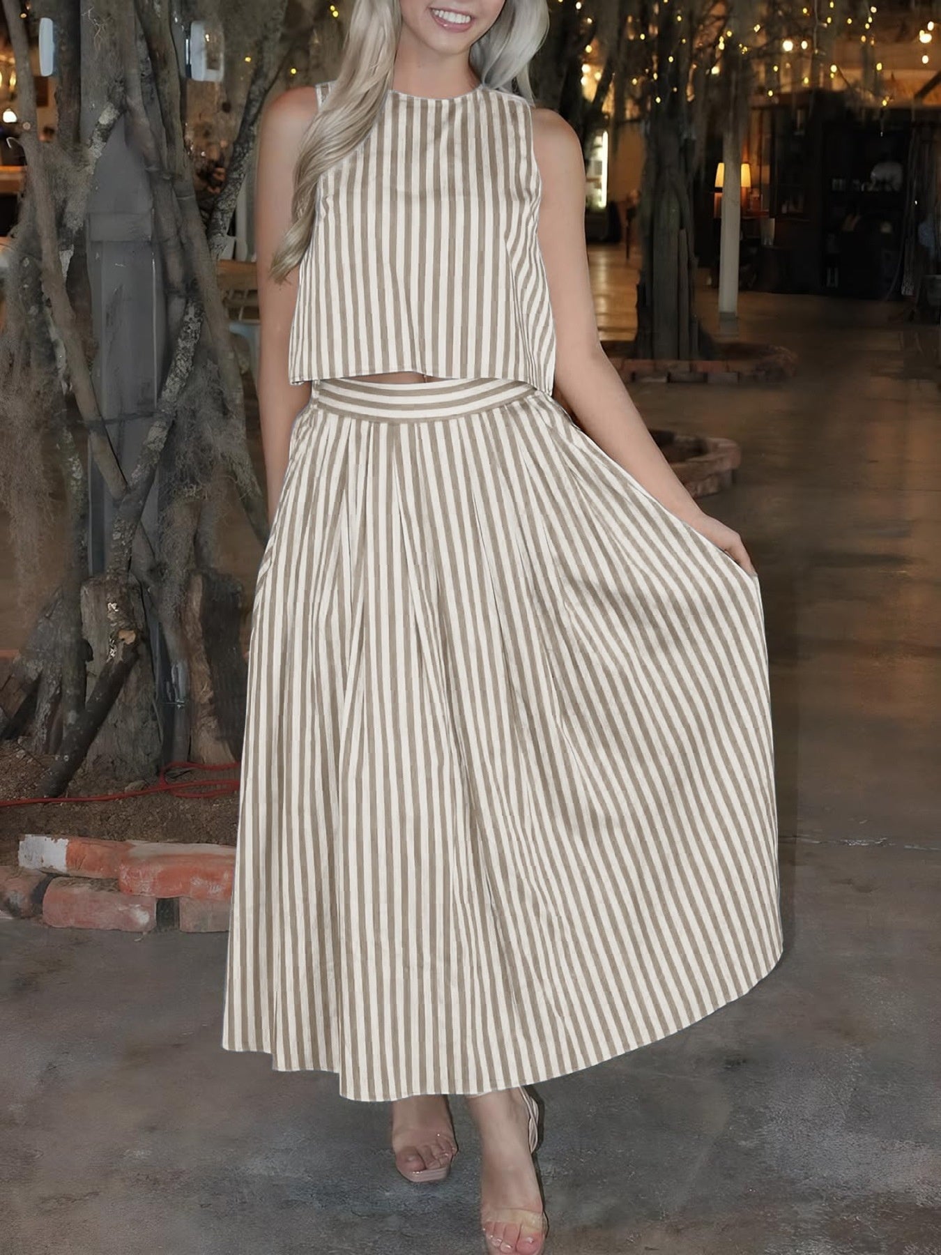 Women's striped sleeveless top and midi skirt two-piece set by Trendsi, featuring a stylish matching striped design.