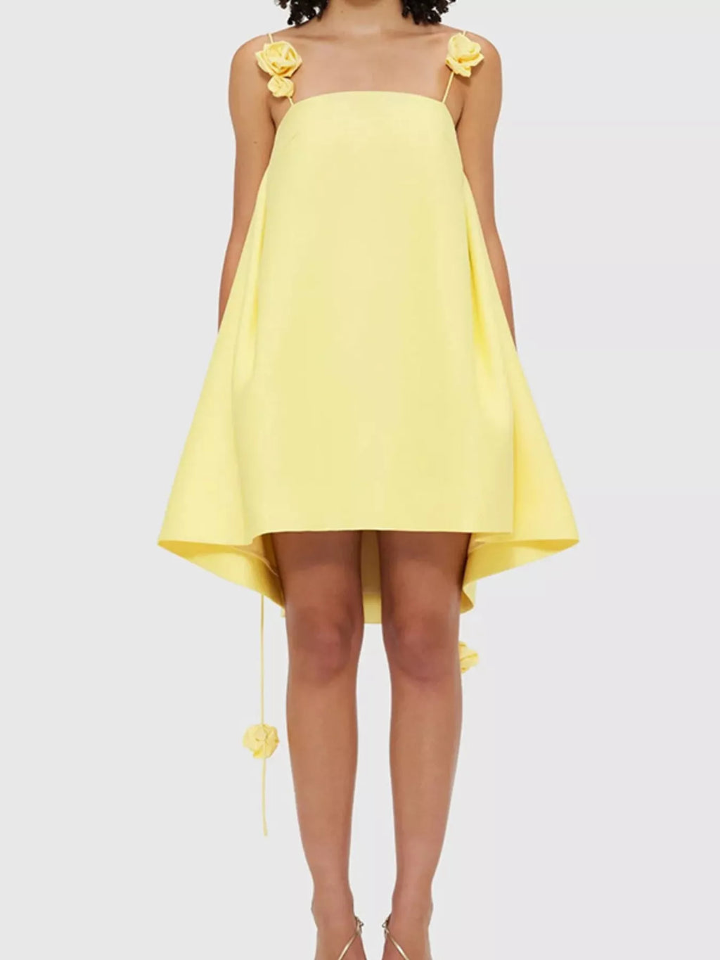 Floral strap mini A-line dress from Trendsi, featuring a fitted bodice, flared skirt, and colorful floral pattern.