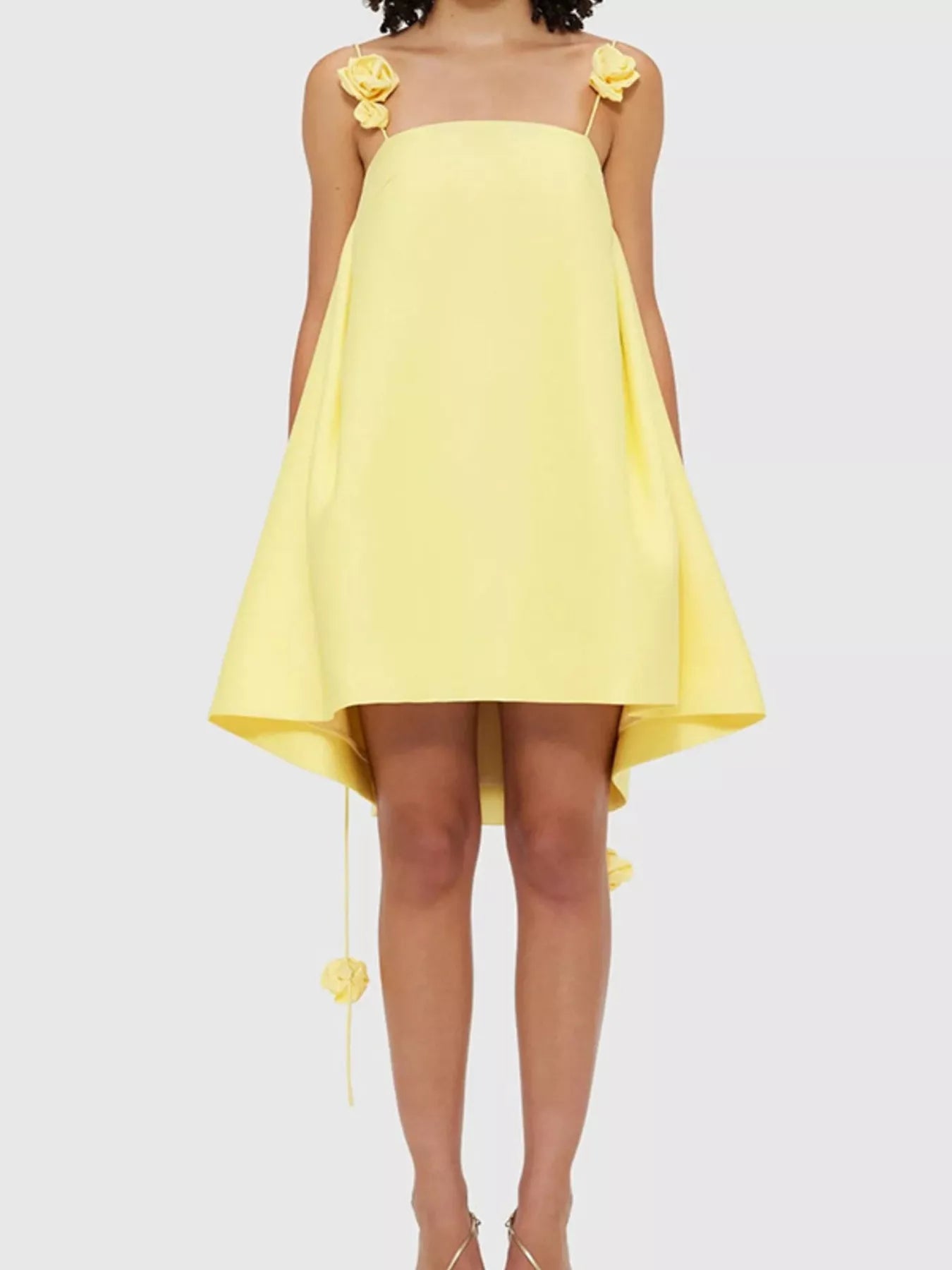 Floral strap mini A-line dress from Trendsi, featuring a fitted bodice, flared skirt, and colorful floral pattern.