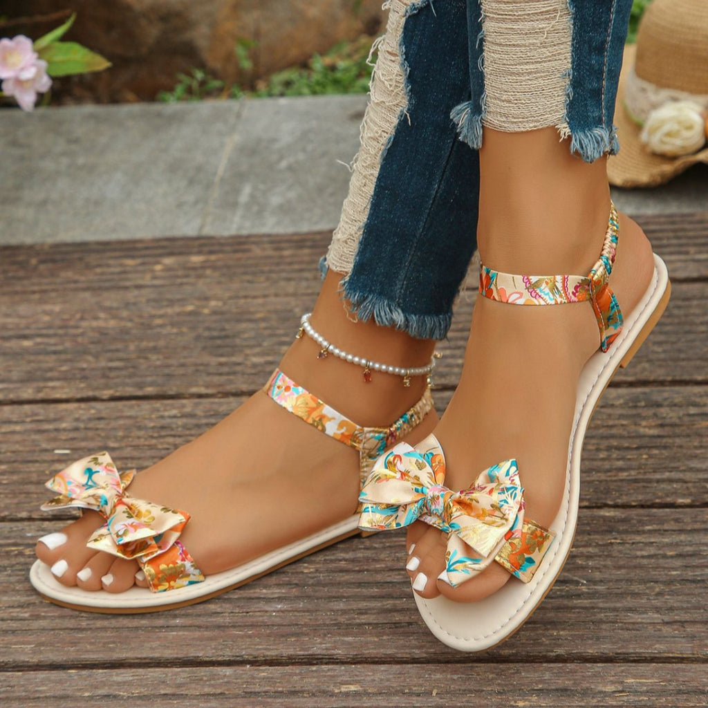 Trendsi floral bowknot ankle strap flat sandals for women, summer shoes with comfortable slip-on design and floral embellishments.