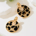 Leopard print circle dangle earrings by Shopimist featuring silver hooks and bold animal pattern jewelry.