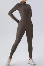 Trendsi half zip mock neck active jumpsuit in sleek athletic wear style, featuring a fitted design and comfortable fabric.