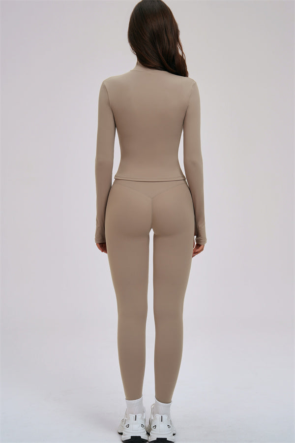 Fitglutes activewear 3-piece set with a zip jacket, cross-back sports bra, and leggings designed for gym and workout activities.