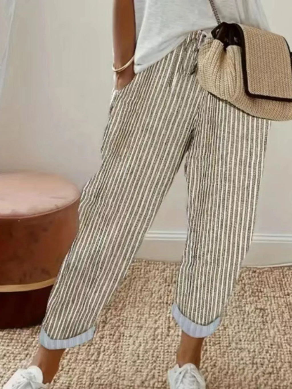 Striped cropped pants by Shopimist featuring a high-waist design and bold vertical stripes, shown on a model.