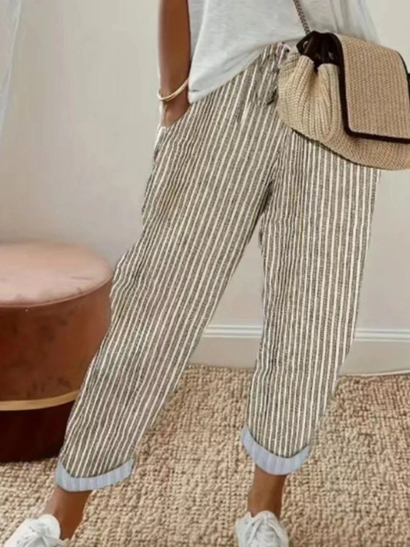 Striped cropped pants by Shopimist featuring a high-waist design and bold vertical stripes, shown on a model.