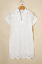 Solid color eyelet embroidered T-shirt mini dress from Trendsi featuring eyelet details and casual fit, perfect for warm weather.