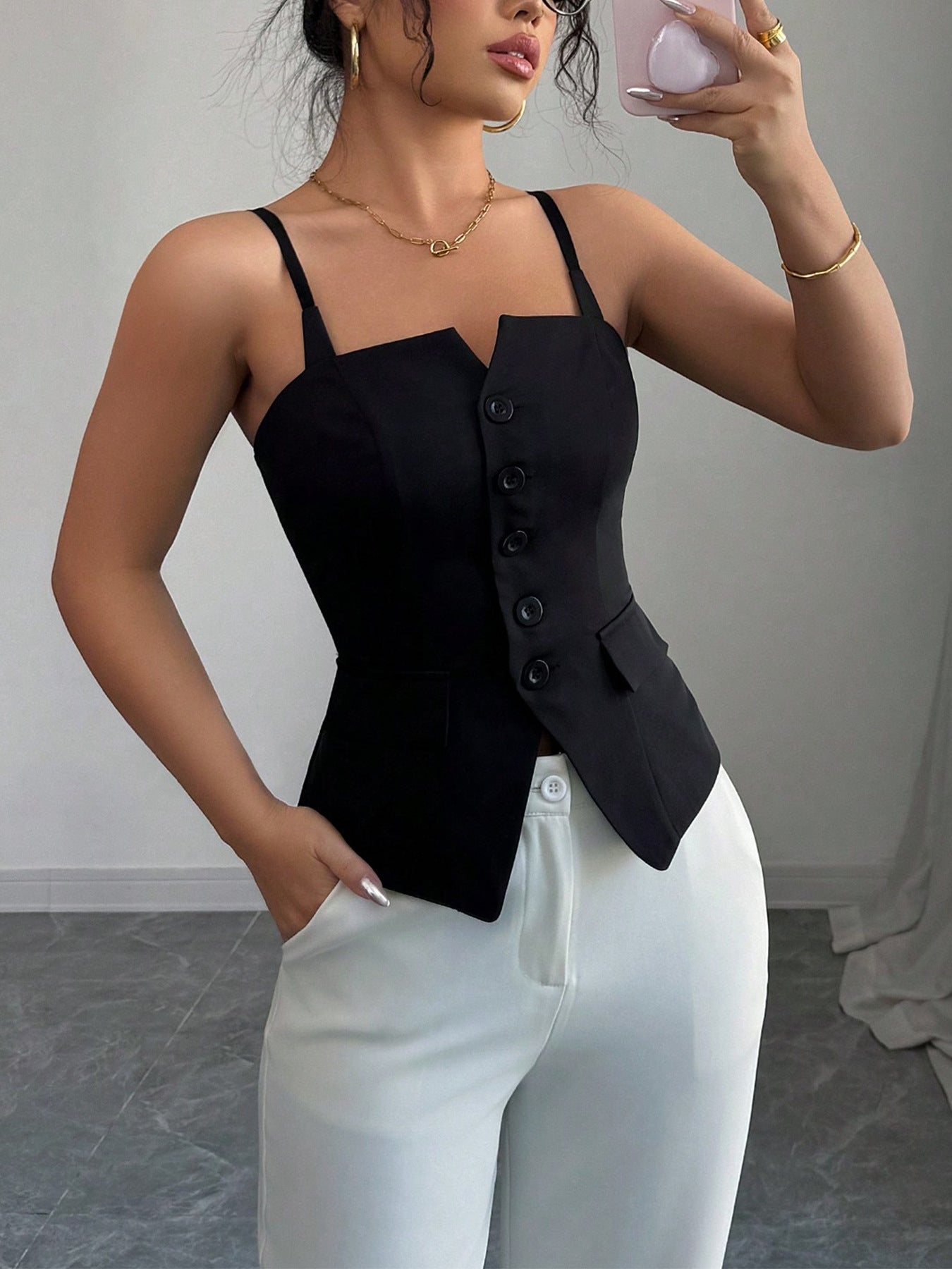 Women's fitted sleeveless V-neck cami tank top from Trendsi, featuring a button-front design perfect for summer wear.