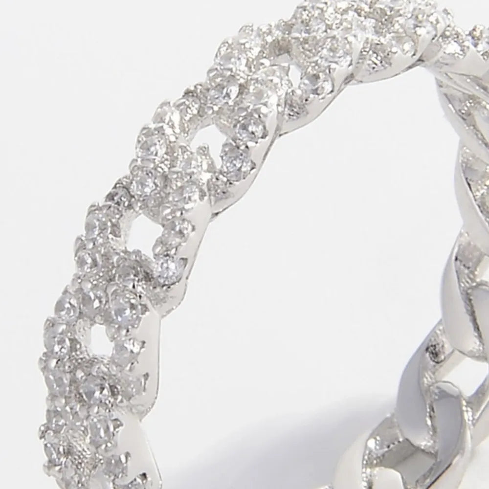 925 Sterling Silver Zircon Inlaid Ring featuring sparkling zircon stones and intricate silver detailing.