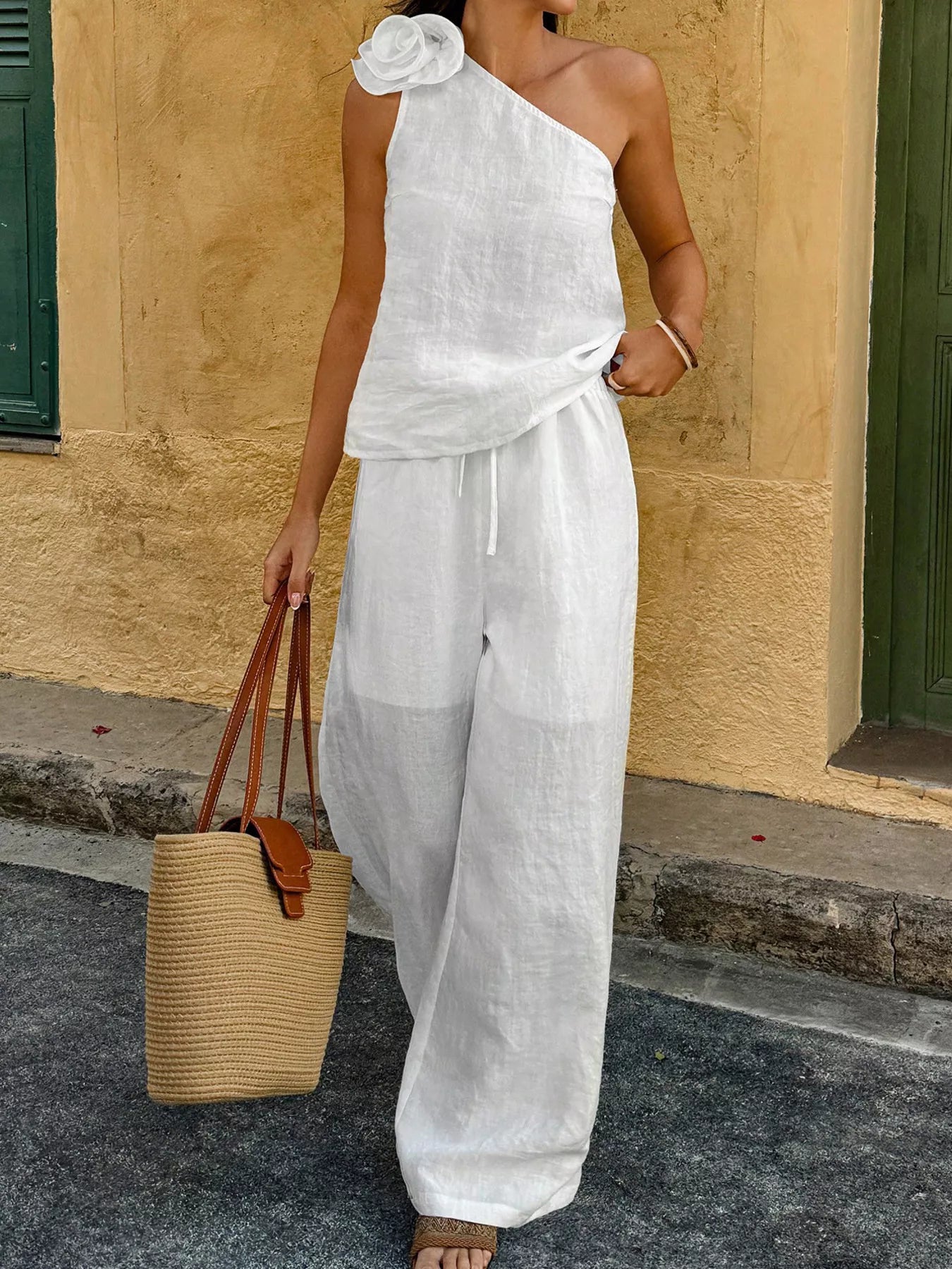 Floral embellished one-shoulder top and matching pants set by Plush Fashion Hub, stylish two-piece outfit with intricate floral details.