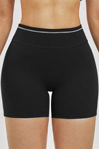 Fitglutes Activewear sports bra and shorts 2-piece set, breathable gymwear and workout clothes for active women, black and pink color.