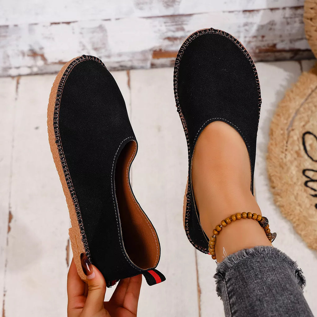 Shopimist round toe flats slip-ons with smooth leather exterior and comfortable flat sole, shown in a neutral color.