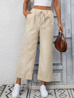 Women's striped wide-leg drawstring pants with pockets from Trendsi, featuring a relaxed fit and casual style.