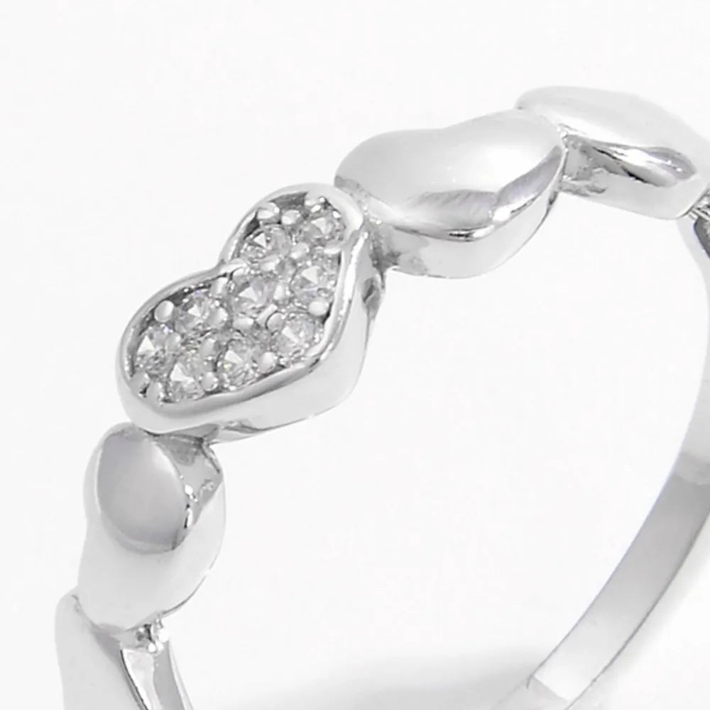 Sterling silver heart ring with inlaid zircon stones, elegant jewelry piece showcasing a sparkling design and fine craftsmanship.