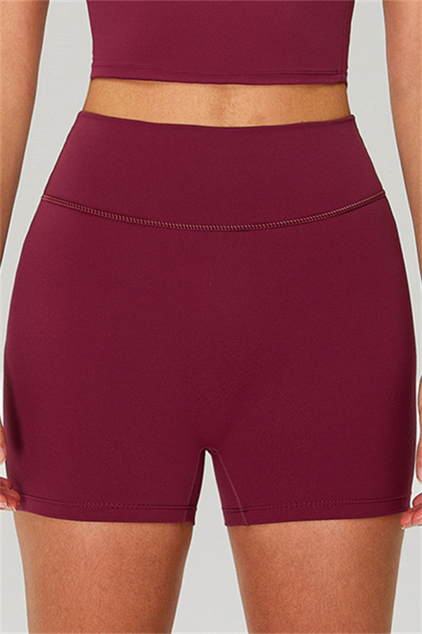 Fitglutes activewear one-shoulder crop top and matching shorts 2-piece gymwear set, stylish workout clothes for women.